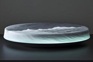 Illuminated circular platform with sculpted wave design. photo