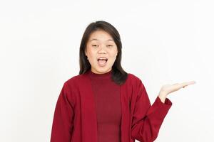 Showing and Presenting Product on Open Palm Of Beautiful Asian Woman Isolated On White Background photo
