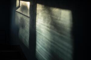 The light in the building. The rays of the sun on the wall. Window in the entrance. Interior of the building. photo