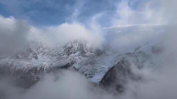Clouds passing mountain peaks mont blanc massif in Chamonix, France in November Les Houches video