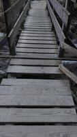 A wooden bridge that is over a stream video