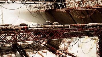 Old destroyed oil terminal with rusted structures and tangled cables in decay video