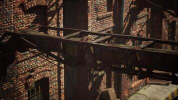 Abandoned factory with collapsing brick structures in urban decay video