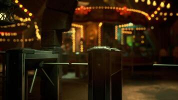 Empty amusement park at night with bright lights and quiet rides video