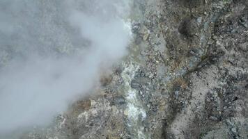 Top view of steaming fumaroles in the Kawah Ratu volcano crater, Java, Indonesia video
