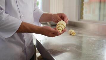 Male Hands Rolling Dough into Rolls, Baking Process Making Croissant. Concept for Bakery video