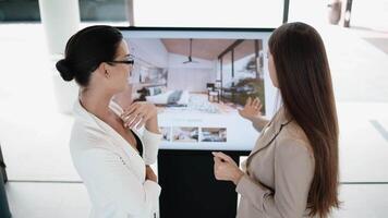 People work together to plan and design apartments, a house using a digital presentation. Analytical 3D Graphics Project. Visualization of Condominium Design. Real estate agency. Vertical shot video
