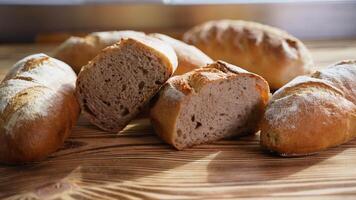 Fresh fragrant breads on the table. Bakery food concept video