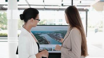 People work together to plan and design apartments, a house using a digital presentation. Analytical 3D Graphics Project. Visualization of Condominium Design. Real estate agency. Vertical shot video