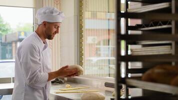 Baker chef is making with flour loaf of dough for preparation of pasta or pizza video