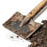 Rustic shovel with dirt on white isolate background. photo