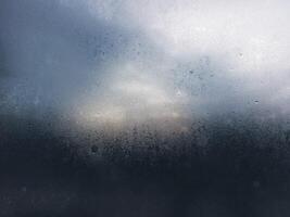 Rain Dew on Glass with a Moody Atmosphere photo