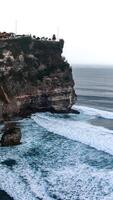 Cliffside Temple Overlooking the Ocean photo