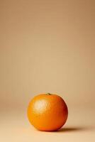 Fresh orange on minimalist beige background with subtle shadows photo