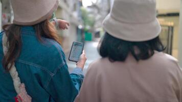 Exploring the City.Two friends in hats stroll through a bustling city street, embracing the adventure and connection of urban exploration. video