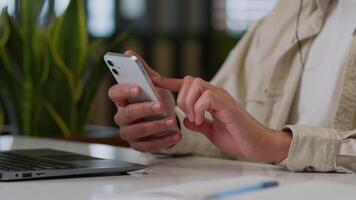 Close up unrecognizable businessman worker business man guy male hands holding mobile phone at desk hold smartphone texting message in web chat surfing corporate network reading news work online using video