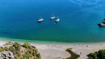 Drone Panoramic View of Clear Sea, Tourist Beach, and Yachts in Open Sea video