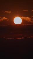 A stunning sunset over fluffy clouds, glowing with warm light, creating a mesmerizing sight video