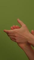 Hands clapping energetically against a green backdrop symbolize appreciation and unity video