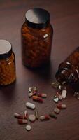 A Variety of Assorted Dietary Supplements and Pills Arranged on a Wooden Surface Table video