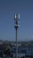 A Telecommunication Tower Stands Against the Clear Sky, Symbolizing Connectivity and Communication video