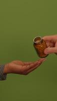 An open hand is shown against a calm green background, symbolizing peace and invitation video
