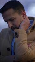 A man in winter attire, deep in thought, creates a serene and reflective atmosphere video