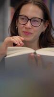 A Joyful Reader Deeply Engrossed in the Pages of an Interesting Book of Literature video