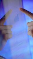 Hands Directing Attention Towards a Financial Chart Displayed on a Digital Screen Surface video