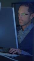 A Focused Professional Working Late into the Night on a Computer or Laptop for Efficiency video