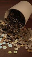 Scattered Coins Beautifully Arranged Inside a Cup A Visual Representation of Wealth and Abundance video