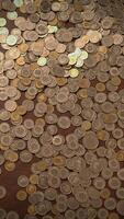 A Collection of Scattered Coins Displayed on a Surface, Showcasing Their Unique Design and Value video
