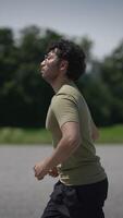 A runner in swift motion is gracefully moving forward beneath a bright and sunny sky today video