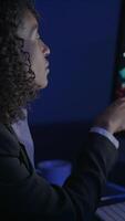 A contemplative professional diligently analyzing various data presented on a computer screen video