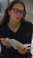 Engaging in Contemplative Reading Within a Beautiful and Modern Living Space Setting video