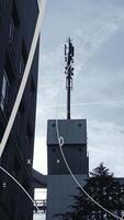 A Communication Tower is Standing Tall Amidst a Scene of Modern Urban Architecture video