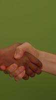 Hands shaking to represent unity and cooperation among diverse backgrounds and cultures video