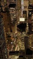 Experience a Stunning Aerial View of a Vibrant City at Night, Illuminated by Bright, Colorful Lights video