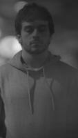 A Thoughtful Young Man Wearing a Hoodie with His Eyes Gently Closed in Deep Contemplation video