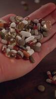 A variety of assorted vitamins and dietary supplements are conveniently in hand for use video