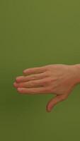 A Hand Gesture that is Pointing Forward against a Bright Green Background for Emphasis video