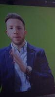 A Professional Speaker Engaging with Their Audience While Utilizing a Green Screen Technique video