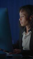 A Focused Professional Dedicatedly Working Late at Their Computer in a Corporate Office video