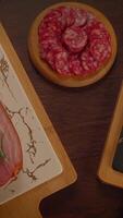 An exquisitely crafted Artisanal Charcuterie Board featuring an array of Sliced Salami video