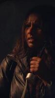 A Dramatic Scene Captured in the Rain Featuring an Umbrella and an Intense Expression video