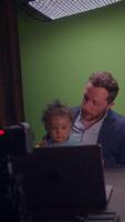 A Professional Father Actively Engaging with His Child During an Interactive Call video