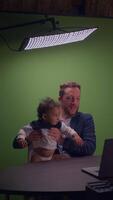 Interaction Between a Father and Child in a Studio Setting That Emphasizes Their Bonding video