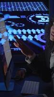 The Data Analyst is analyzing the graphical user interface in a darkened room setting video