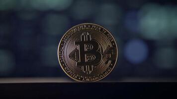 A Shiny Bitcoin Coin Set Against an Abstract Digital Background of Modern Technology video