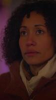 A Reflective Woman Finding Peace in a Dynamic Urban Setting Filled with Life and Culture video